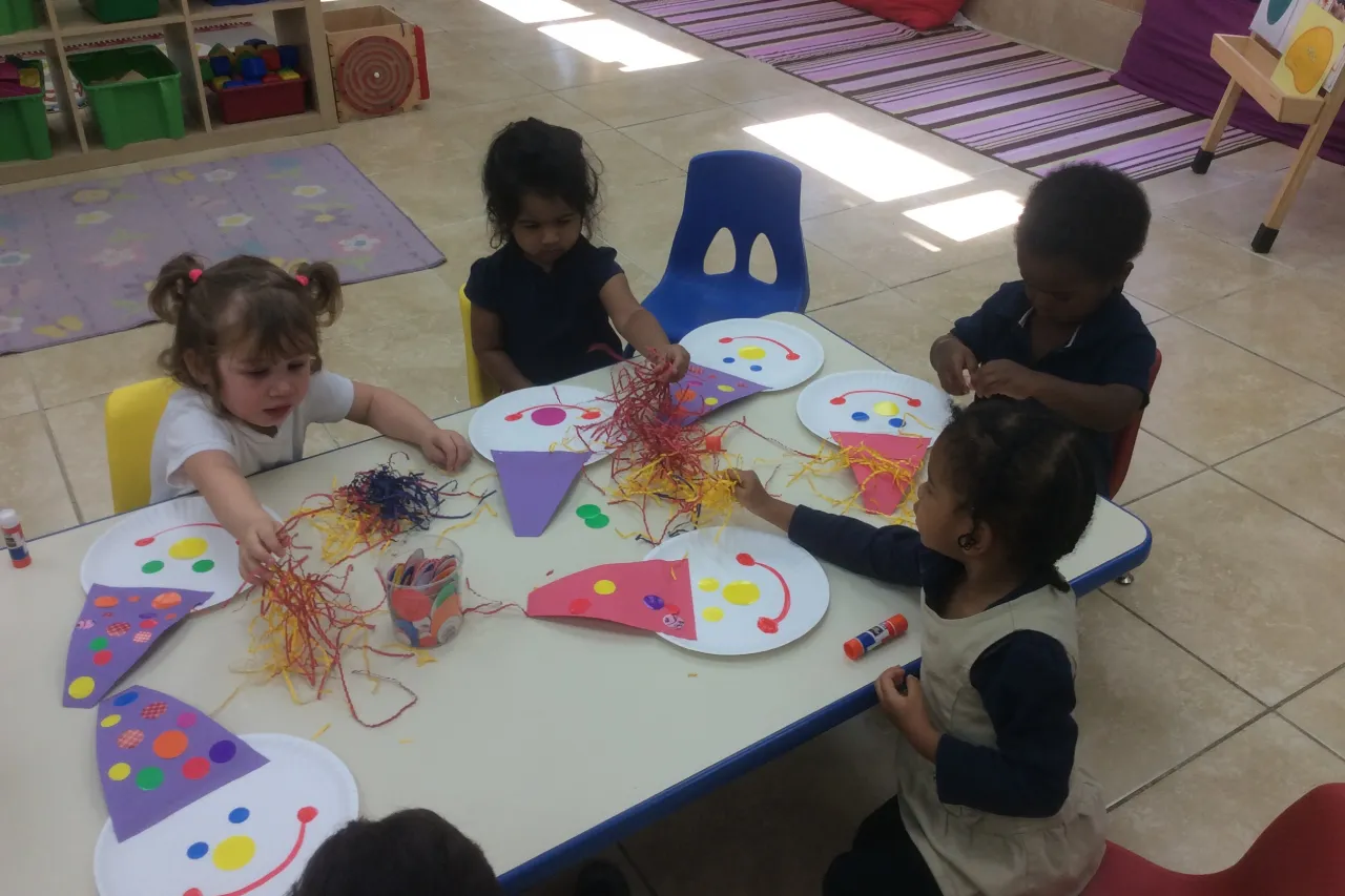 Children creating a colorful craft activity at Horizons Learning Centers in Orlando.