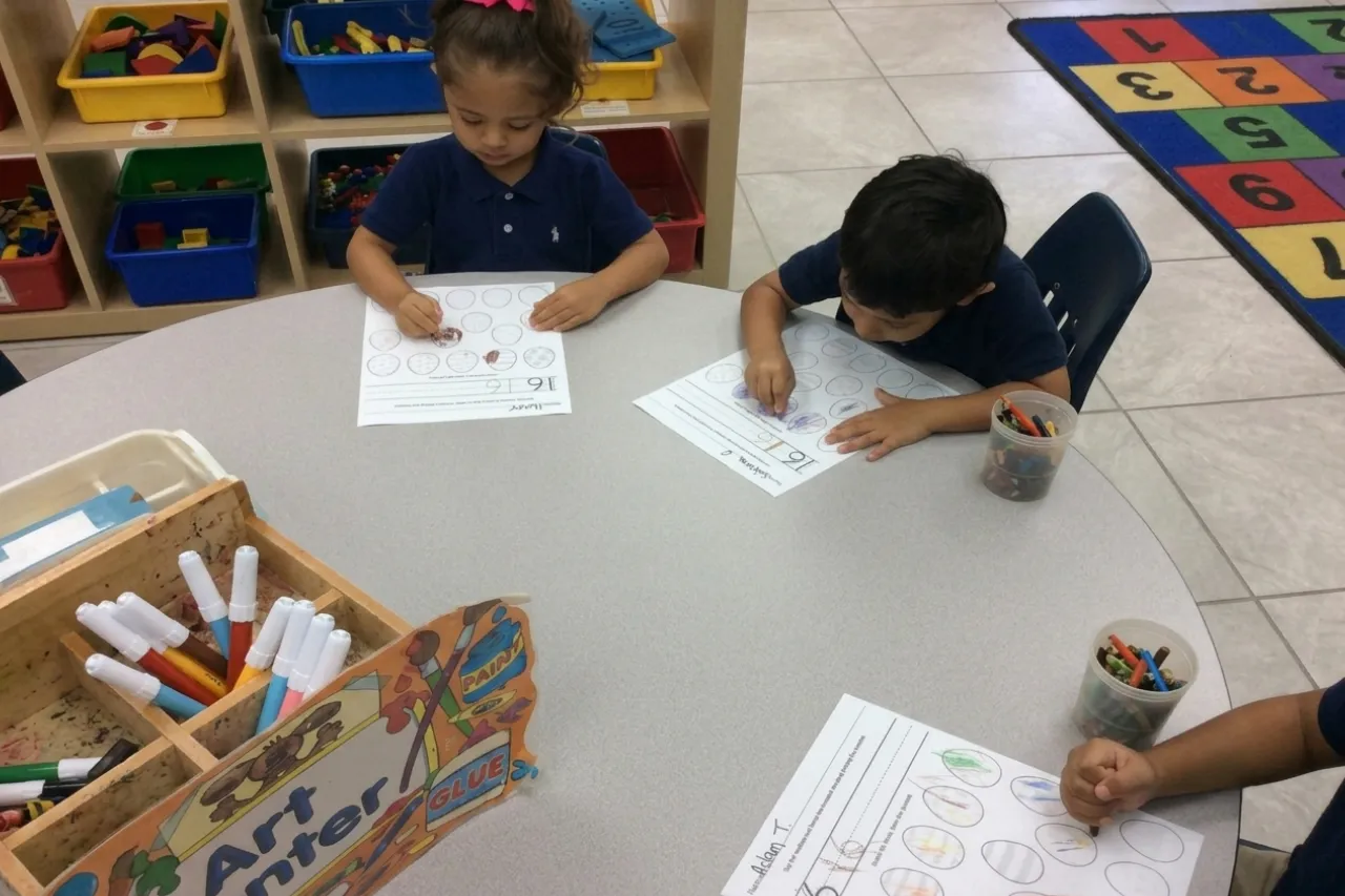 Preschool children completing worksheet activities at Horizons Learning Centers in Orlando.